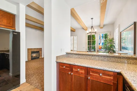 a bedroom with a bed and a fireplace