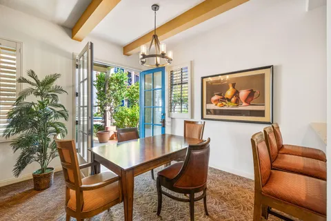 a spacious bedroom with a bed and a window