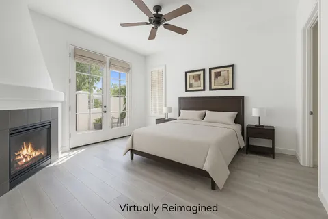 a bathroom with a granite countertop sink a toilet and a mirror