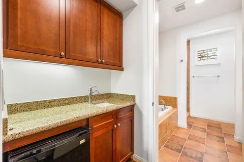 a view of a house with backyard swimming pool and sitting area