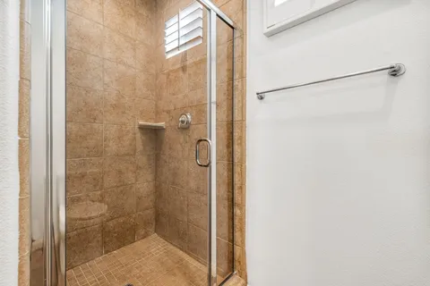 a view of a fountain in the front of a brick house