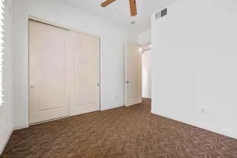 an aerial view of residential houses with outdoor space and parking