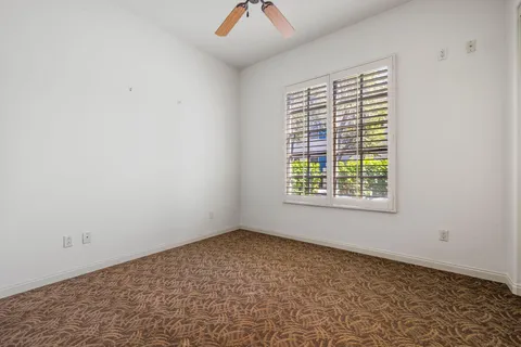 a swimming pool with outdoor seating and yard