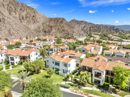 a view of a swimming pool with trees and plants