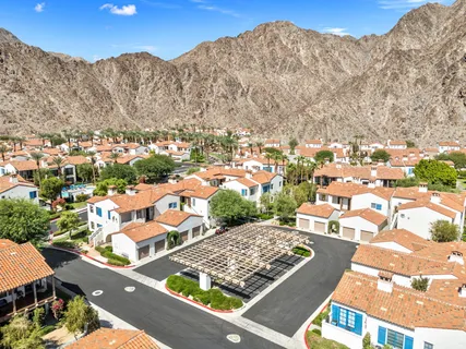 a view of a house with garden and trees