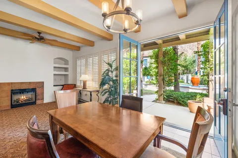 a kitchen with granite countertop sink and window