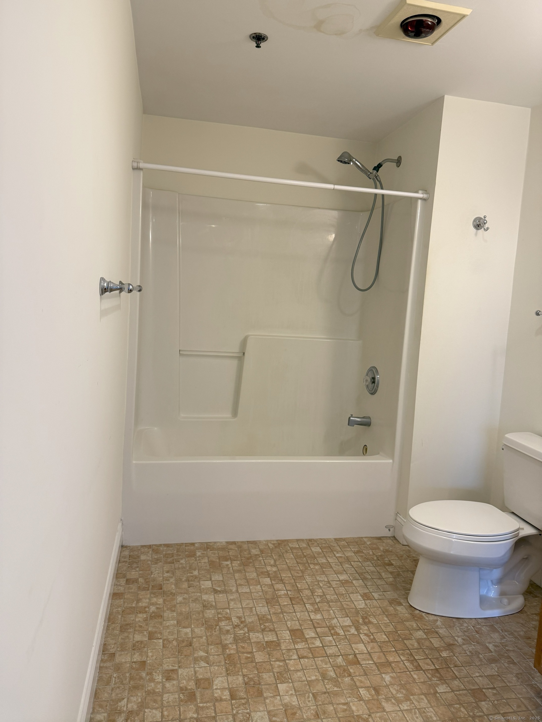 380 Main Street, Unit 16 Wallingford, CT 06492 - Photo 2 of 9 a bathroom with a toilet and a shower