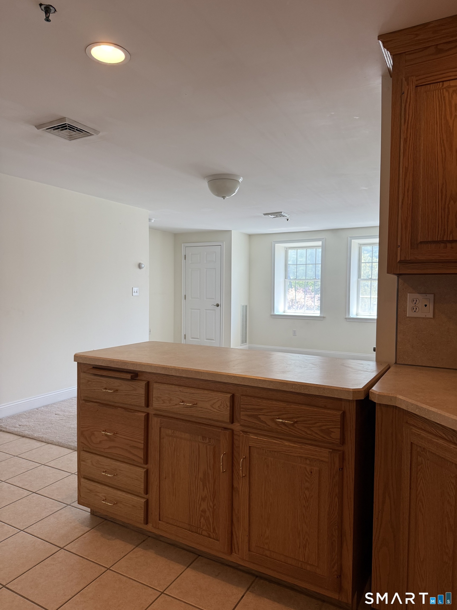 380 Main Street, Unit 16 Wallingford, CT 06492 - Photo 3 of 12 a room with a sink and a mirror