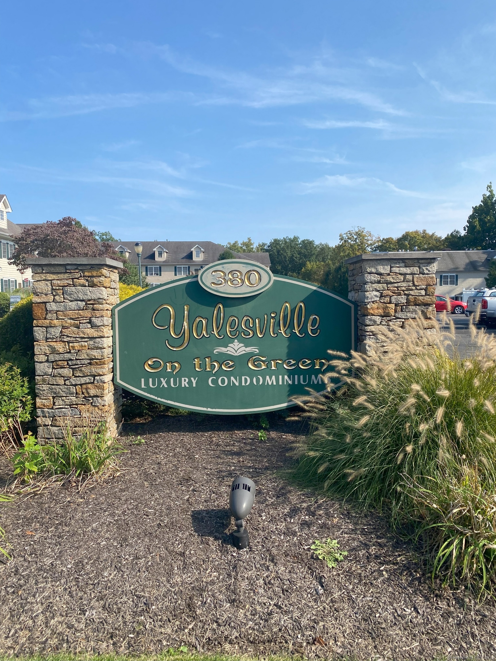 380 Main Street, Unit 16 Wallingford, CT 06492 - Photo 7 of 12 a sign board with a play ground in the back