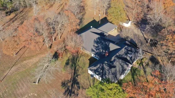 a view of a house with a tree
