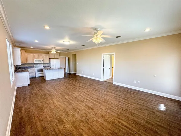 a view of a kitchen with a sink and cabinets