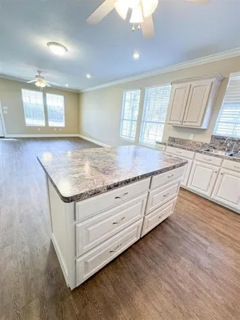 a kitchen with sink and window