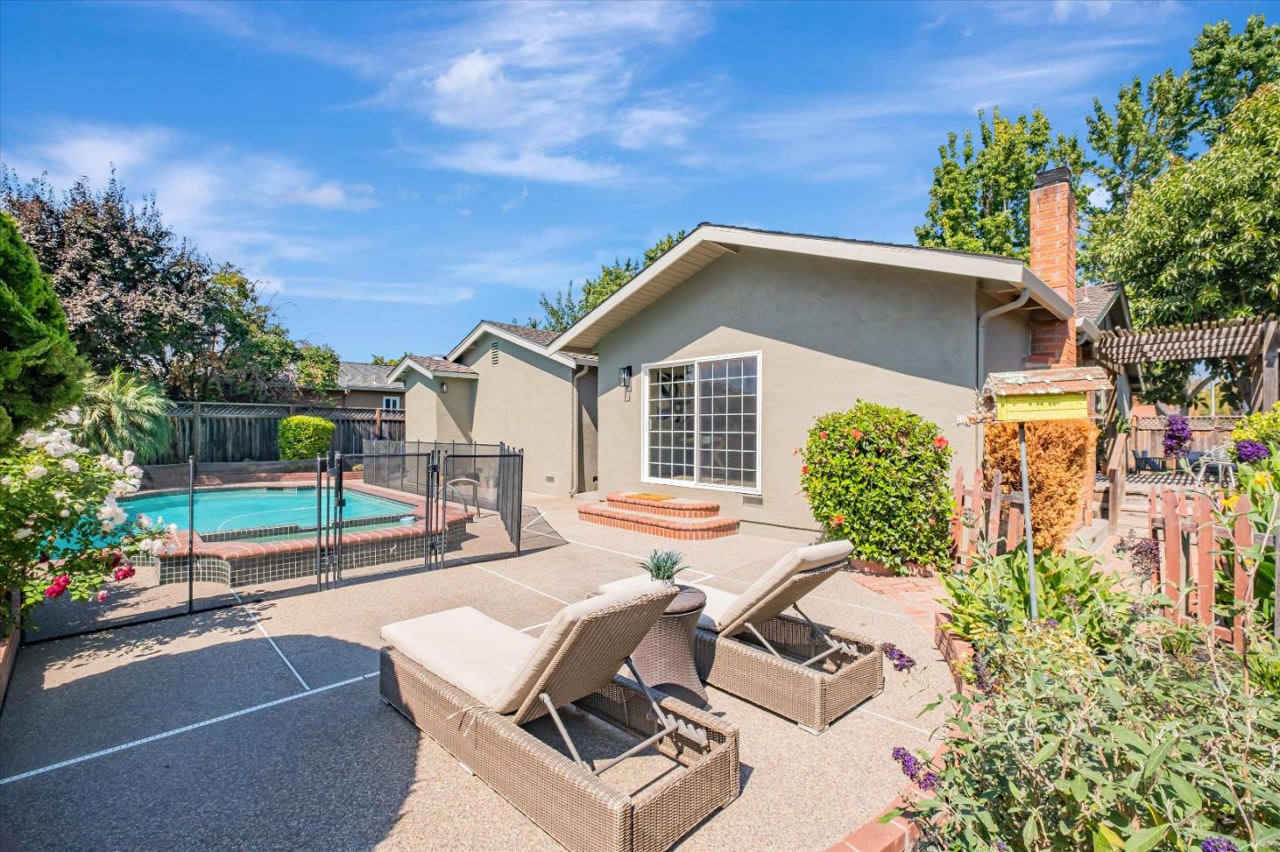 4856 Windermere Drive Newark, CA 94560 - Photo 4 of 6 a view of a patio with table and chairs and potted plants