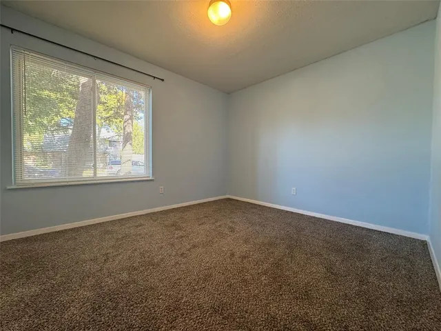 a bathroom with a sink toilet vanity and shower