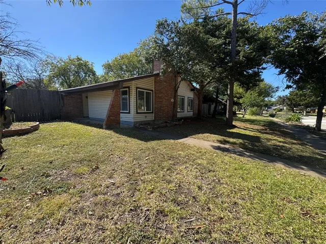a view of a backyard with a house