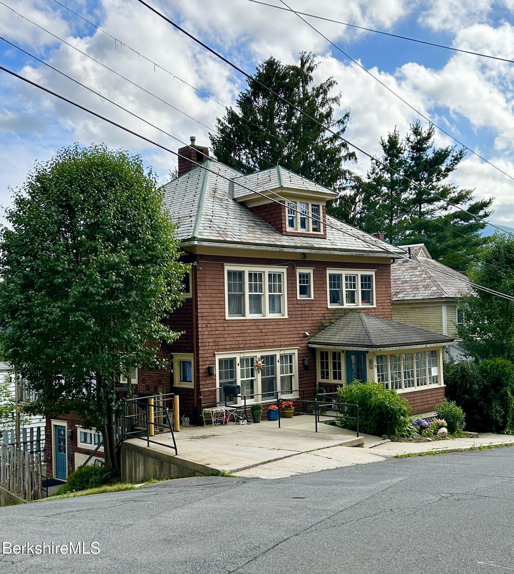 96 East Quincy Street North Adams, MA 01247 - Photo 1 of 16 a front view of a house with a garden