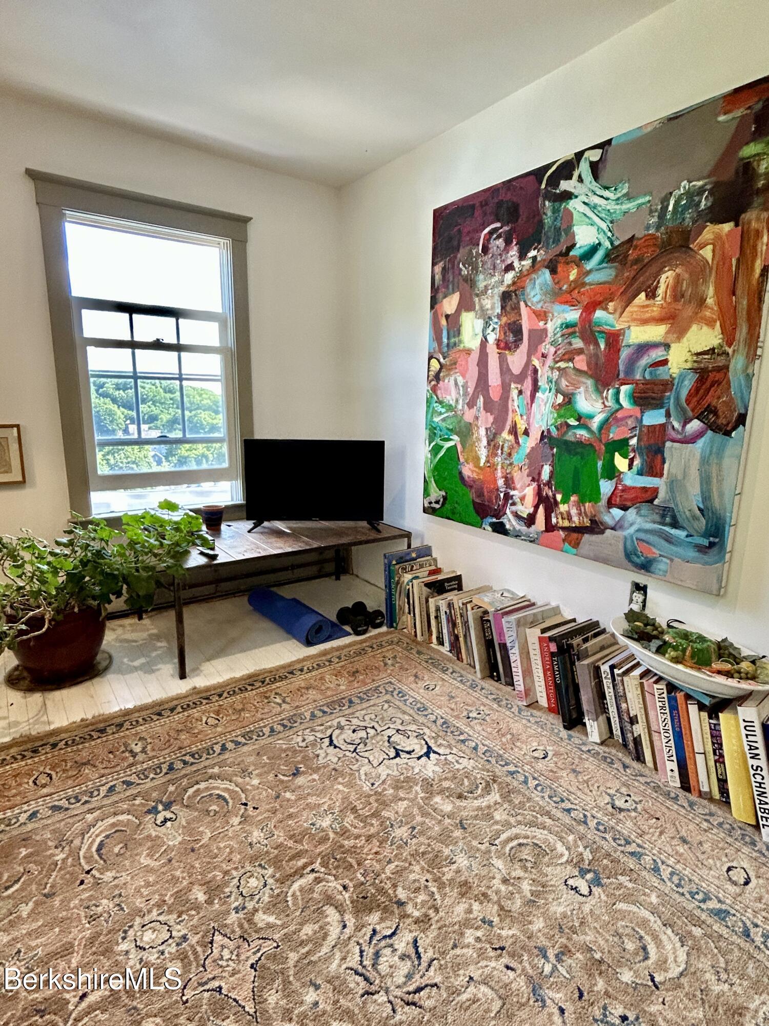 96 East Quincy Street North Adams, MA 01247 - Photo 16 of 16 a living room with lots of furniture and a flat screen tv
