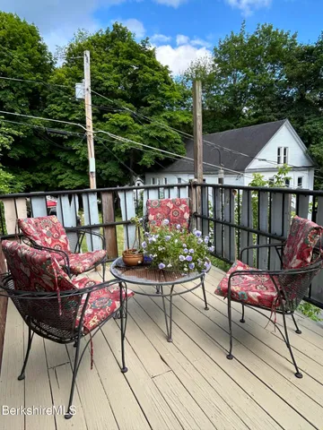 a patio with table and chairs