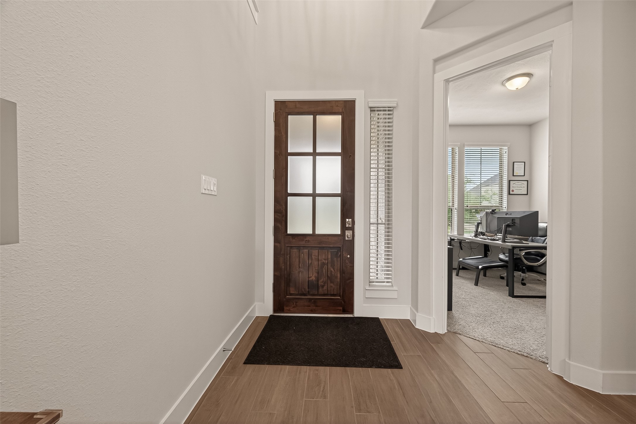 1815 Brea Rdg Trail Katy, TX 77494 - Photo 3 of 43 A welcoming entryway with a wooden front door featuring frosted glass panels.