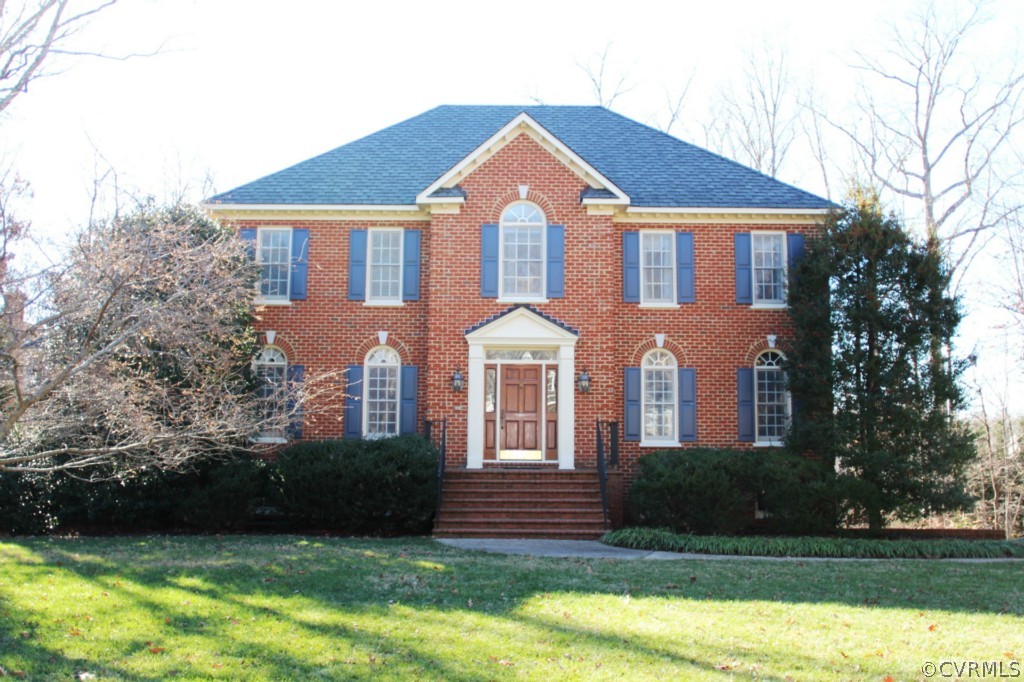 a front view of a house with a yard