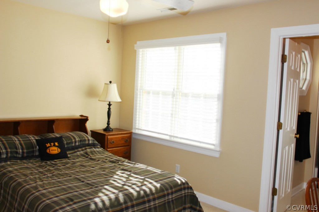 14431 Newgate Road Midlothian, VA 23113 - Photo 16 of 24 a bedroom with a bed and a window