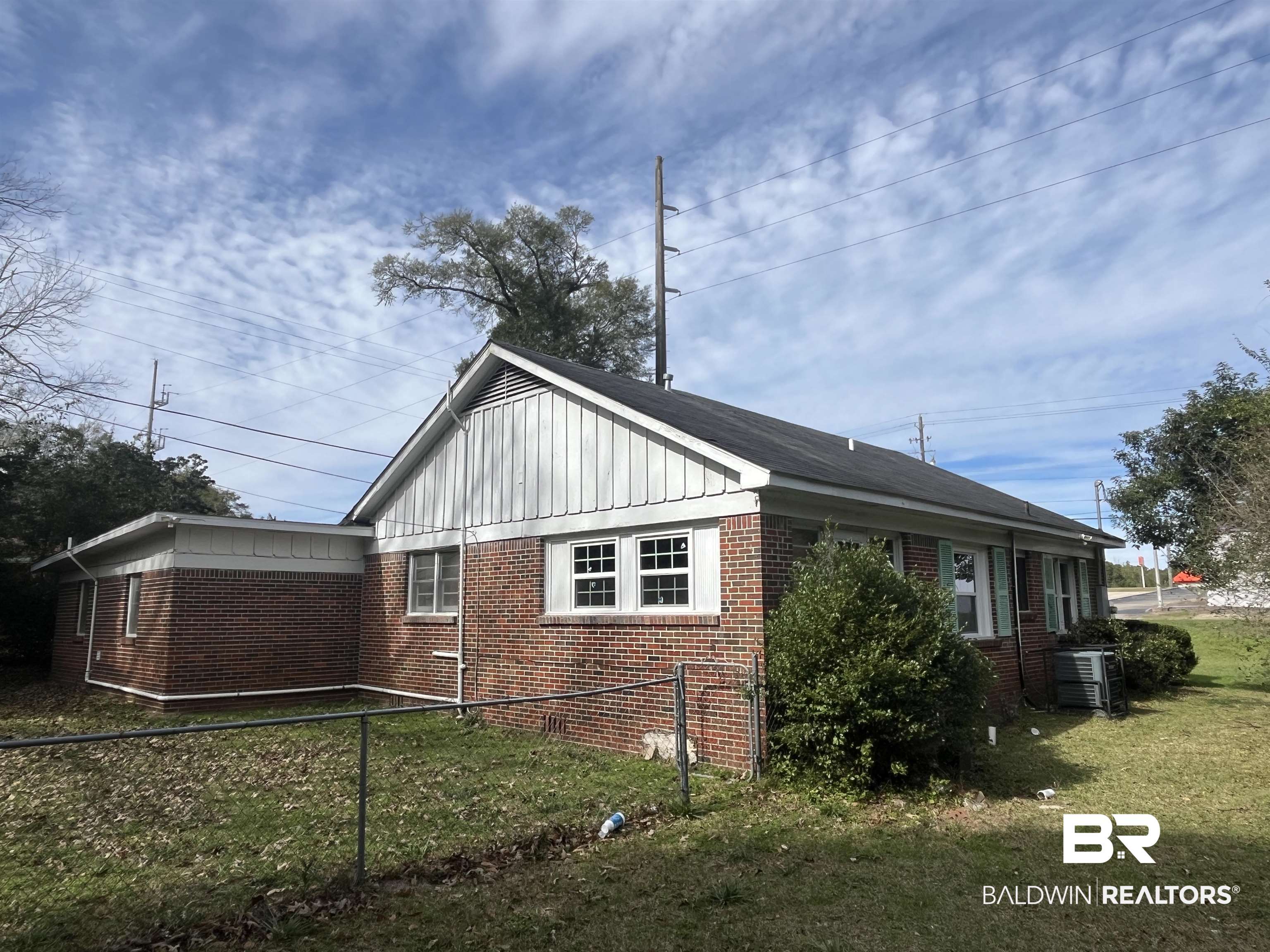 5055 Overlook Road Mobile, AL 36618 - Photo 17 of 28 View of home's exterior featuring board and batten siding and brick siding