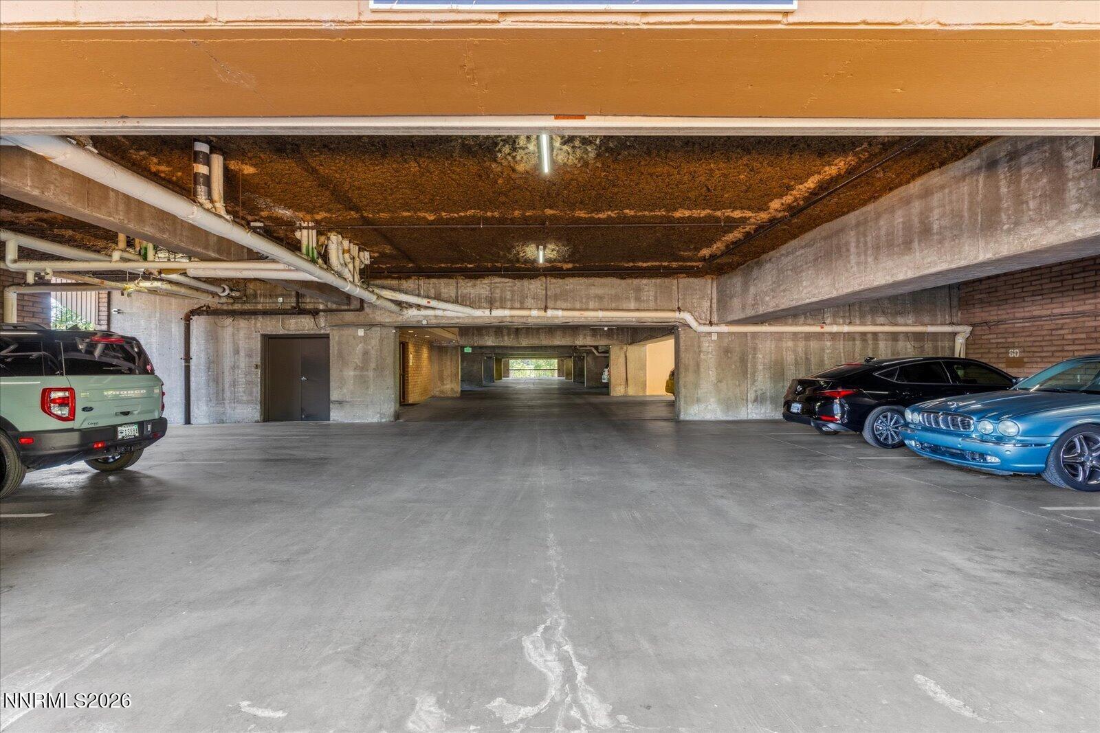 1200 Riverside Drive, Unit 1229 Reno, NV 89503 - Photo 51 of 51 a view of parking garage with cars