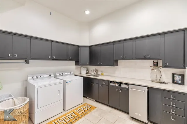 a kitchen with a sink a stove and cabinets