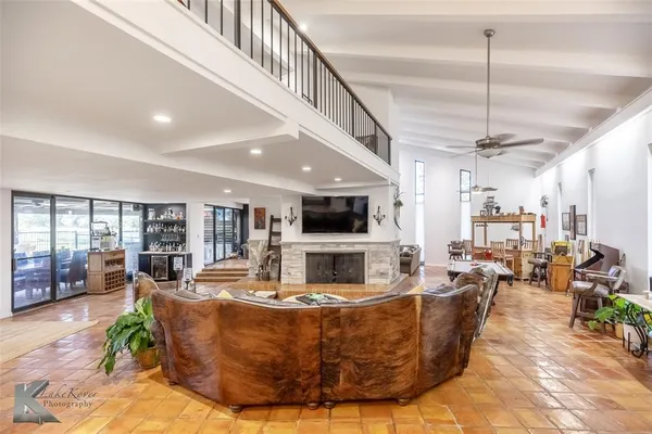 a living room with fireplace furniture and a flat screen tv