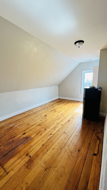 76 Eleanor Street, Unit 3 Chelsea, MA 02150 - Photo 6 of 9 a view of an empty room and wooden floor