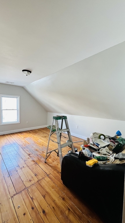 76 Eleanor Street, Unit 3 Chelsea, MA 02150 - Photo 7 of 9 a bedroom with a bed and wooden floor
