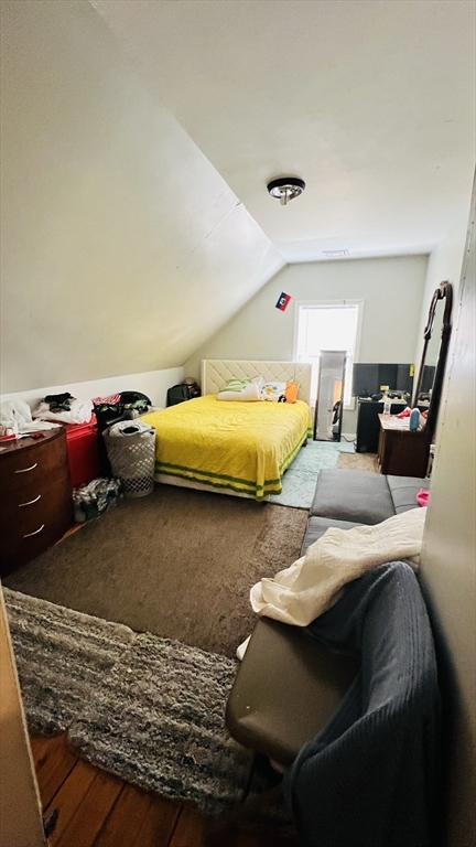 76 Eleanor Street, Unit 3 Chelsea, MA 02150 - Photo 9 of 9 a bedroom with furniture and a wooden floor