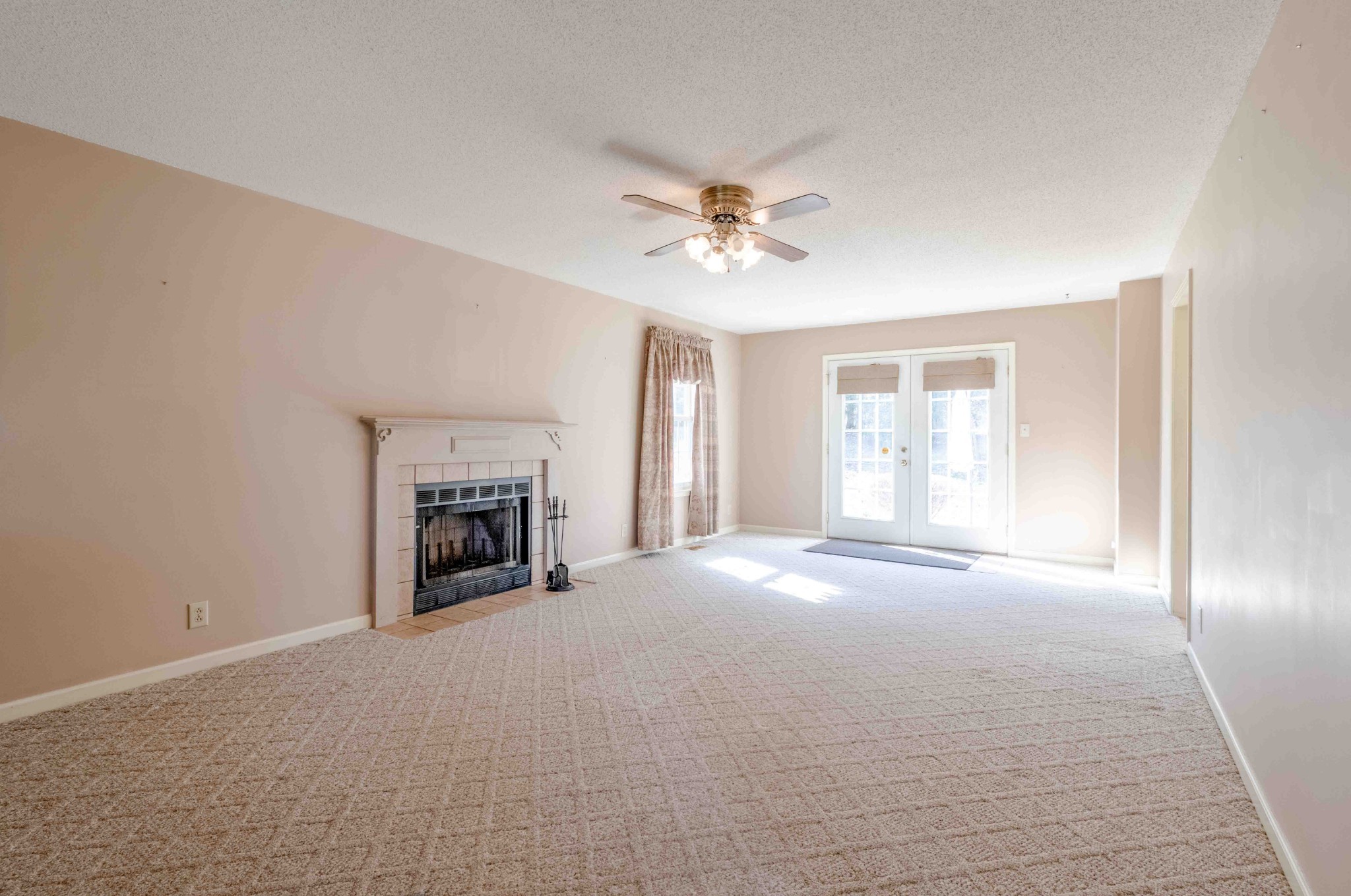 4316 Memory Lane Adams, TN 37010 - Photo 16 of 45 a view of empty room with a fireplace and fan