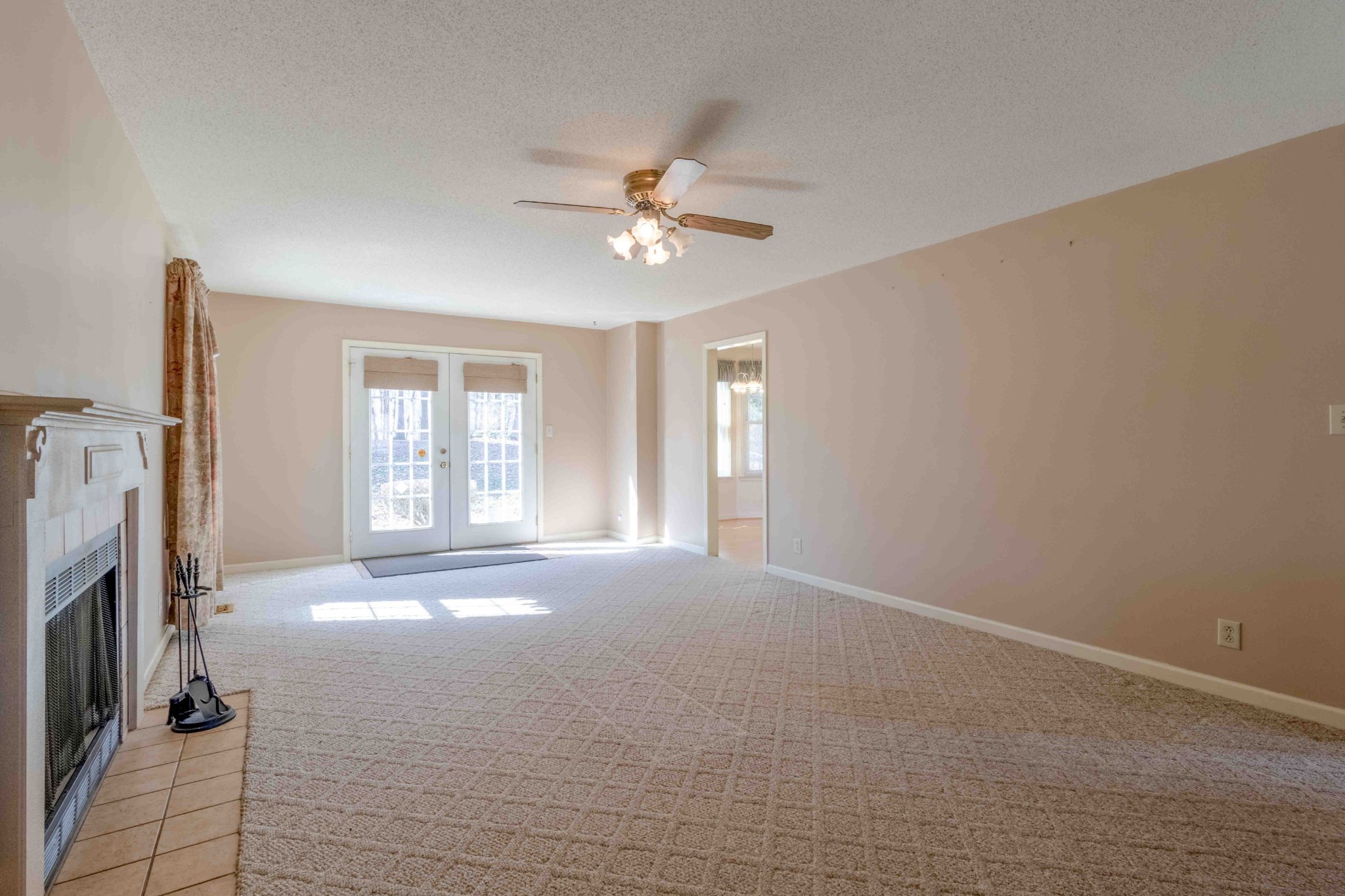4316 Memory Lane Adams, TN 37010 - Photo 17 of 45 a view of a livingroom with a ceiling fan and a window
