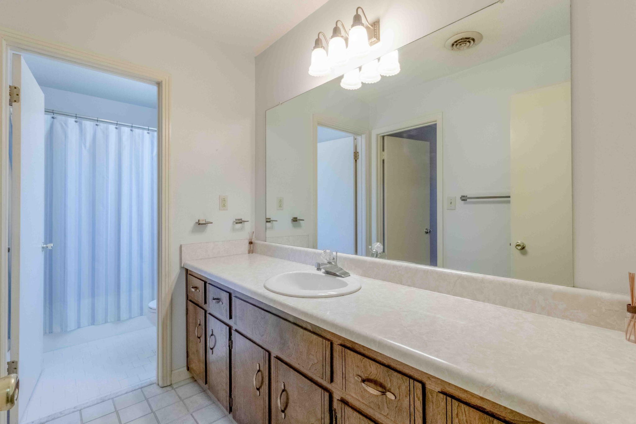 4316 Memory Lane Adams, TN 37010 - Photo 29 of 45 a bathroom with a sink vanity and a mirror