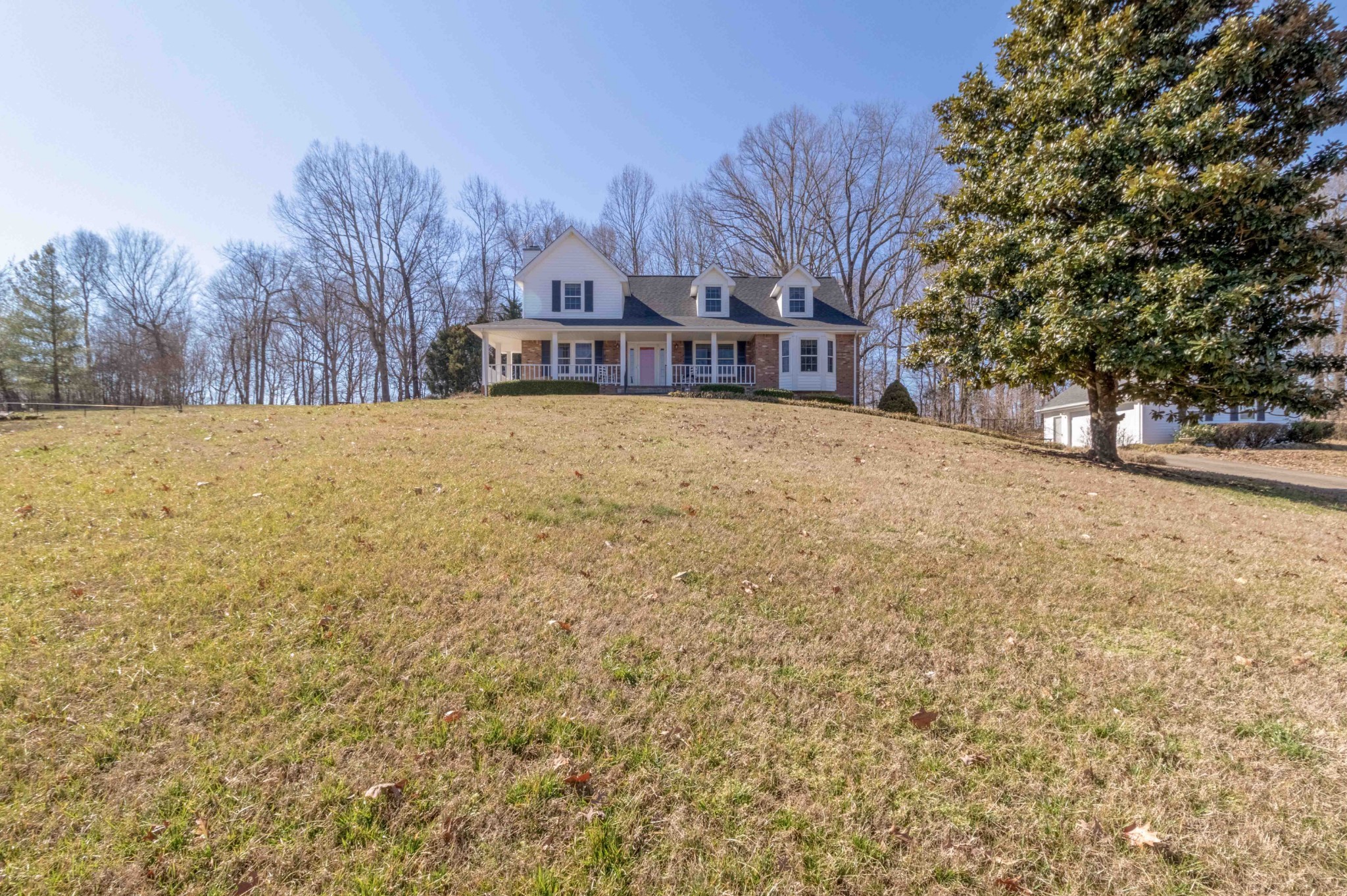 4316 Memory Lane Adams, TN 37010 - Photo 4 of 45 a yellow and white house with a large tree in front of it