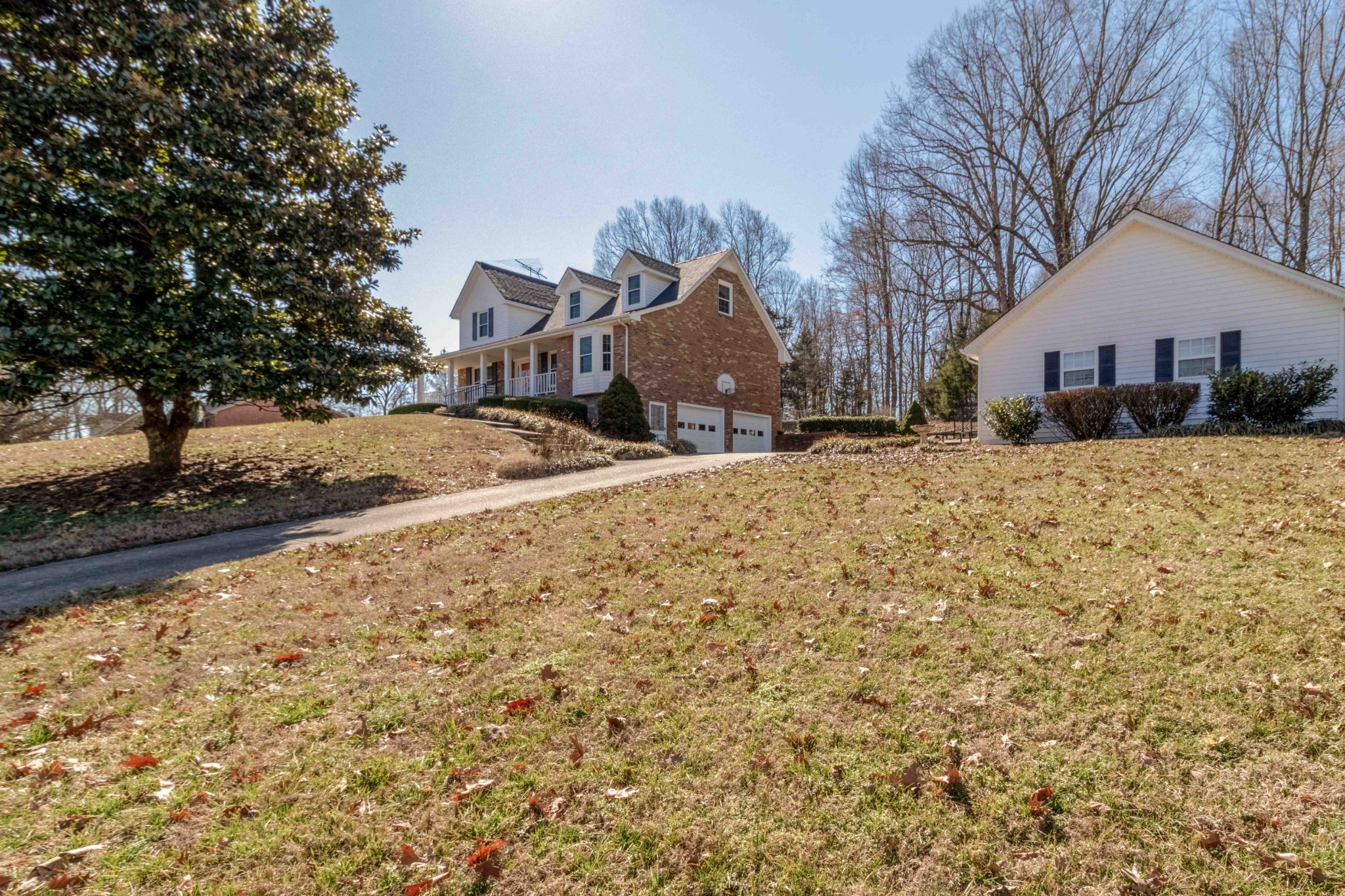 4316 Memory Lane Adams, TN 37010 - Photo 6 of 45 a view of a white house with a yard covered in snow