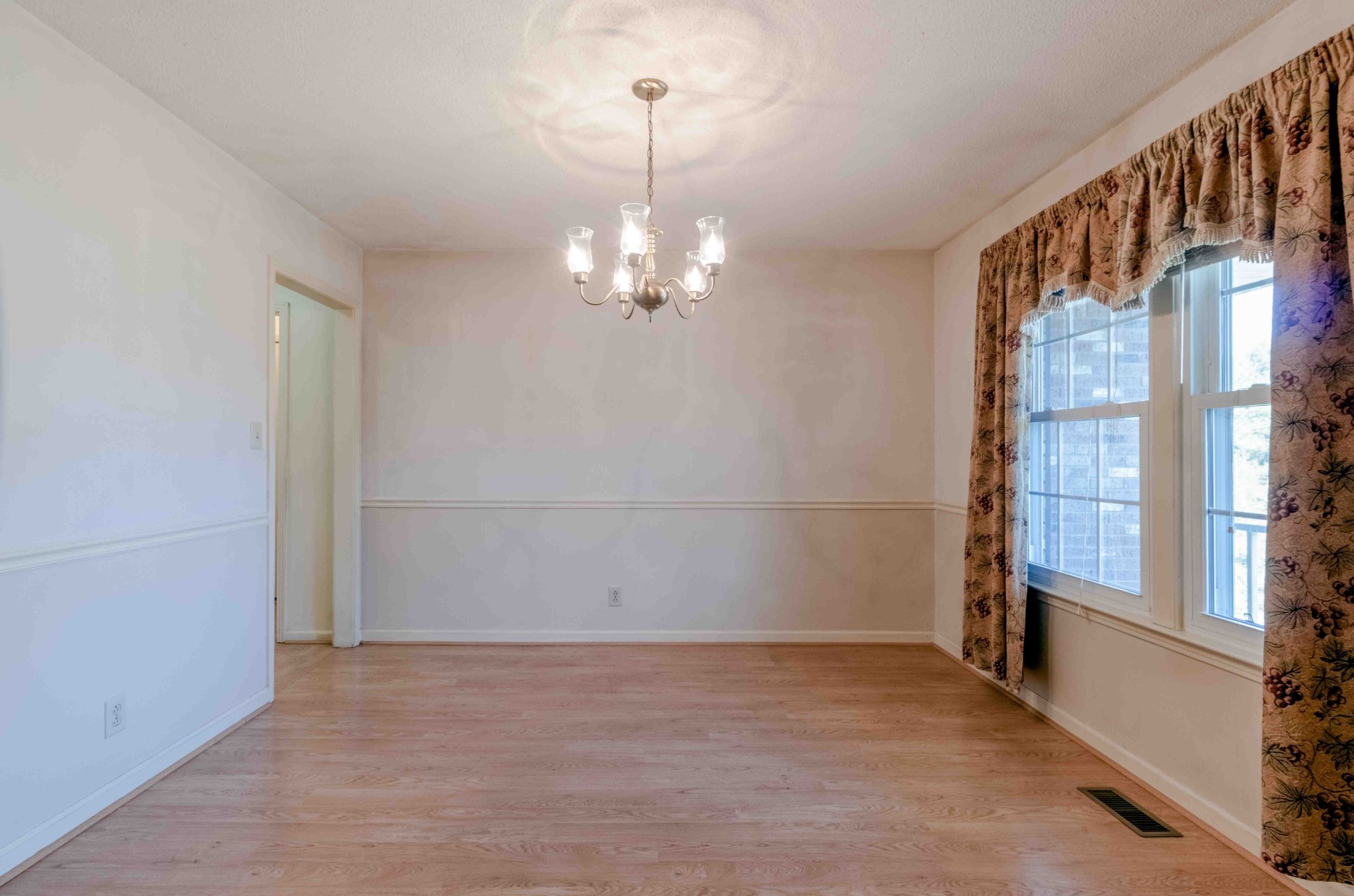 4316 Memory Lane Adams, TN 37010 - Photo 9 of 45 wooden floor in an empty room with a window