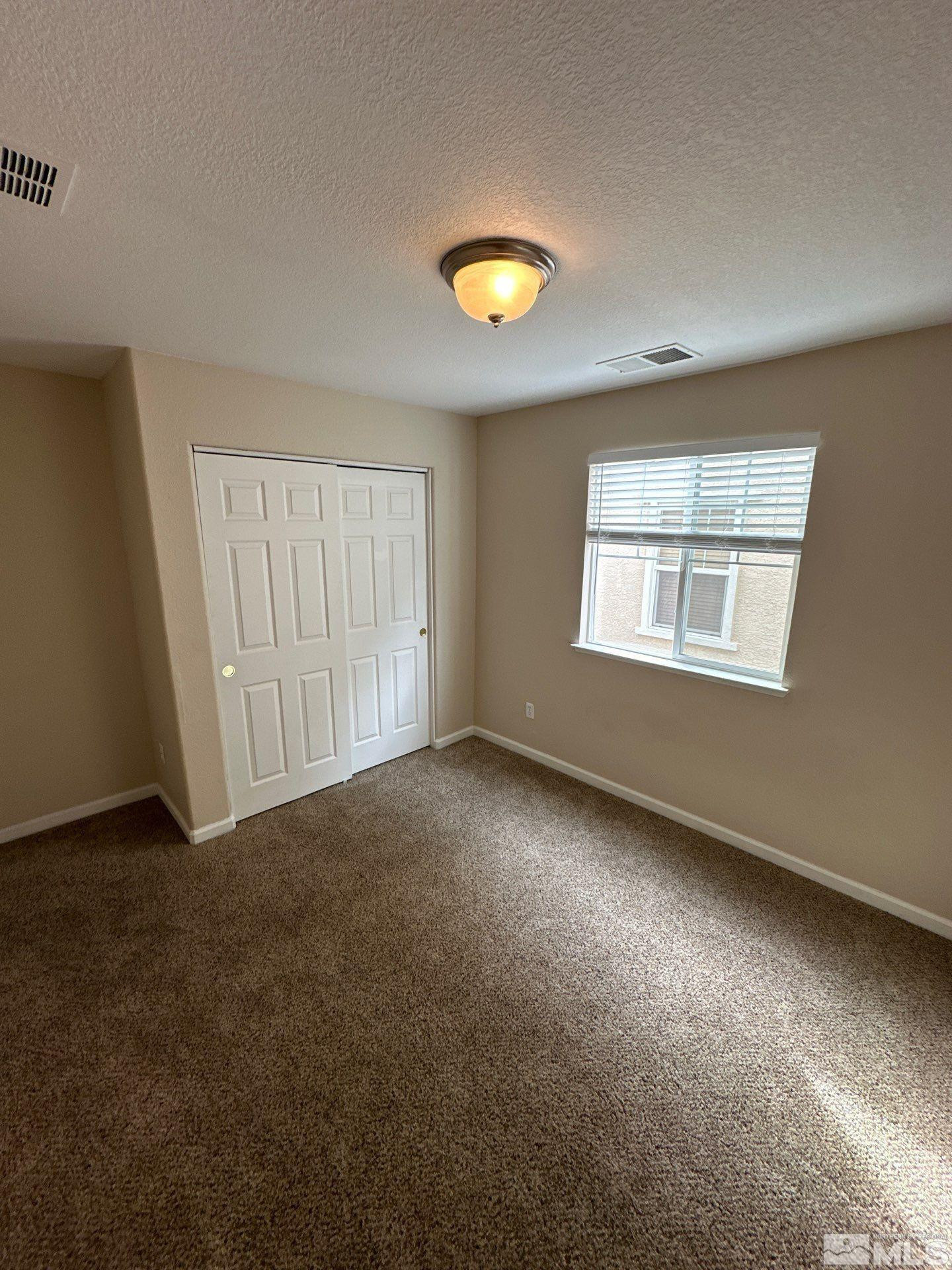 3994 Dominus Drive Sparks, NV 89436 - Photo 14 of 18 an empty room with a window