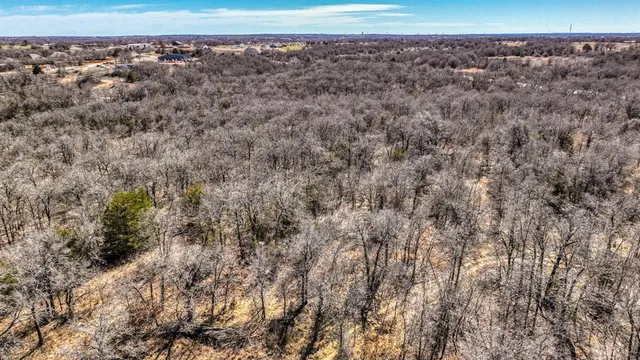 a view of an outdoor space with wooden fence
