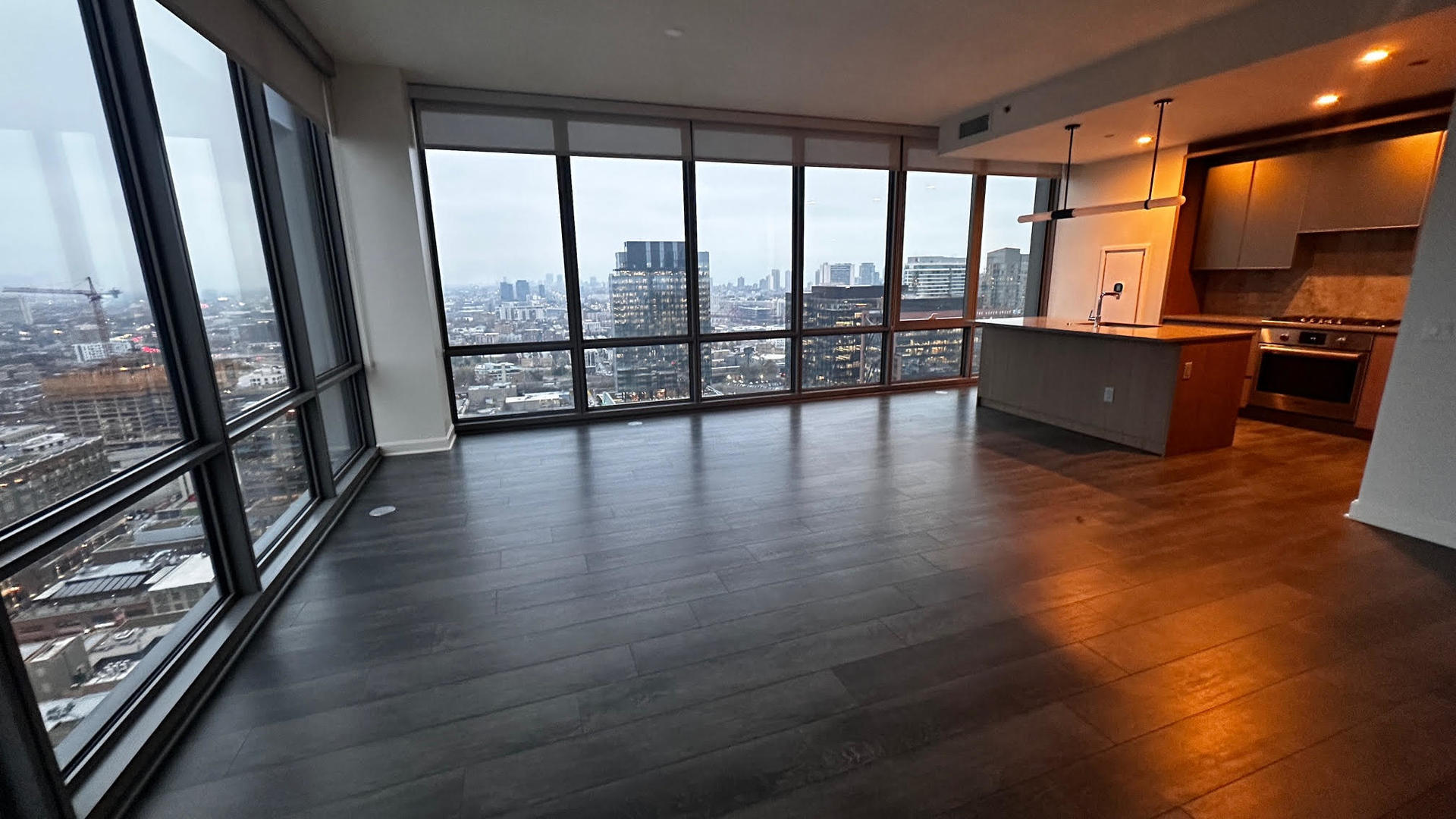 164 North Peoria Street, Unit 3002 Chicago, IL 60607 - Photo 13 of 20 a view of an empty room with wooden floor and a window