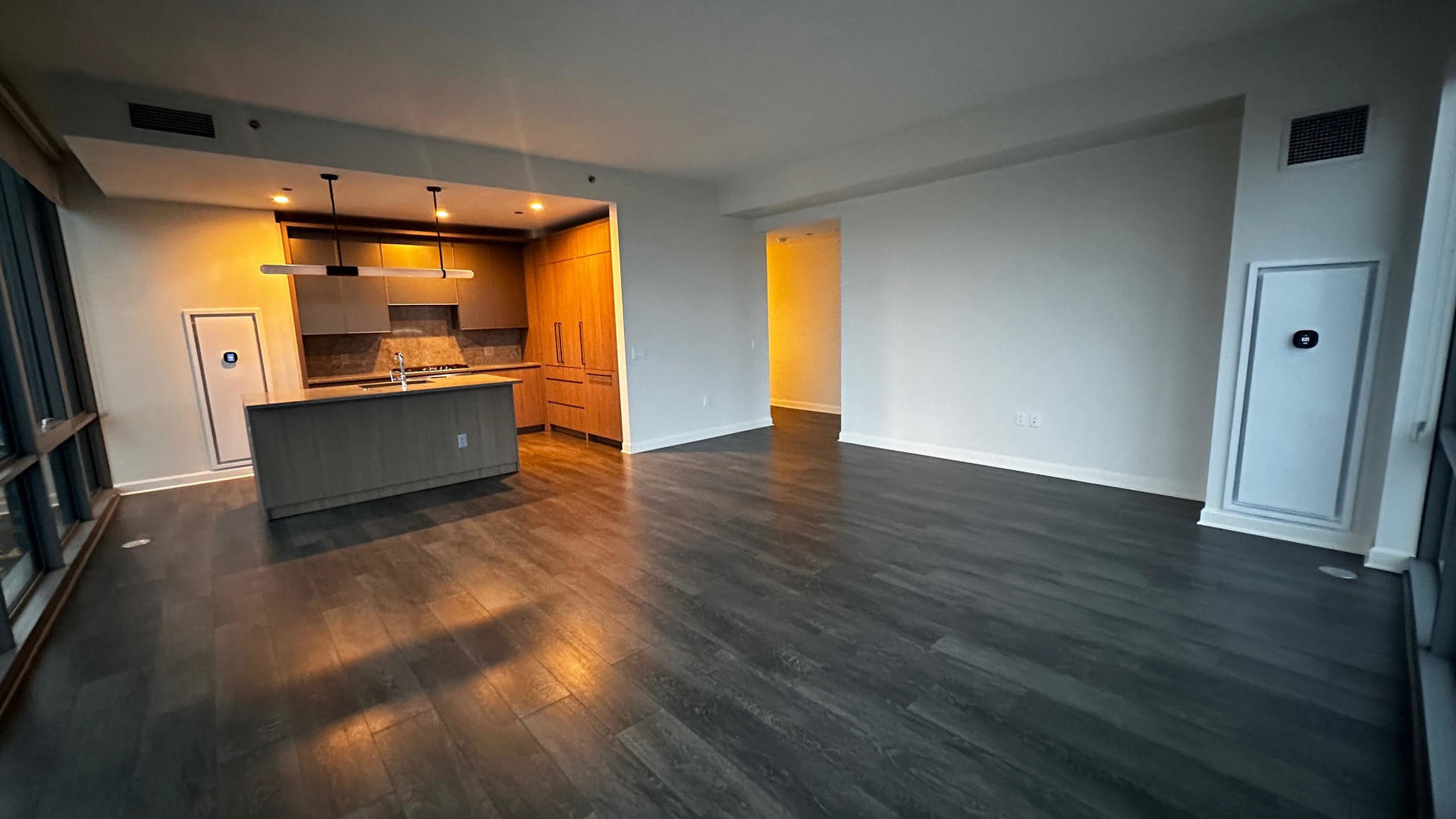 164 North Peoria Street, Unit 3002 Chicago, IL 60607 - Photo 14 of 20 a view of a big room with wooden floor and windows