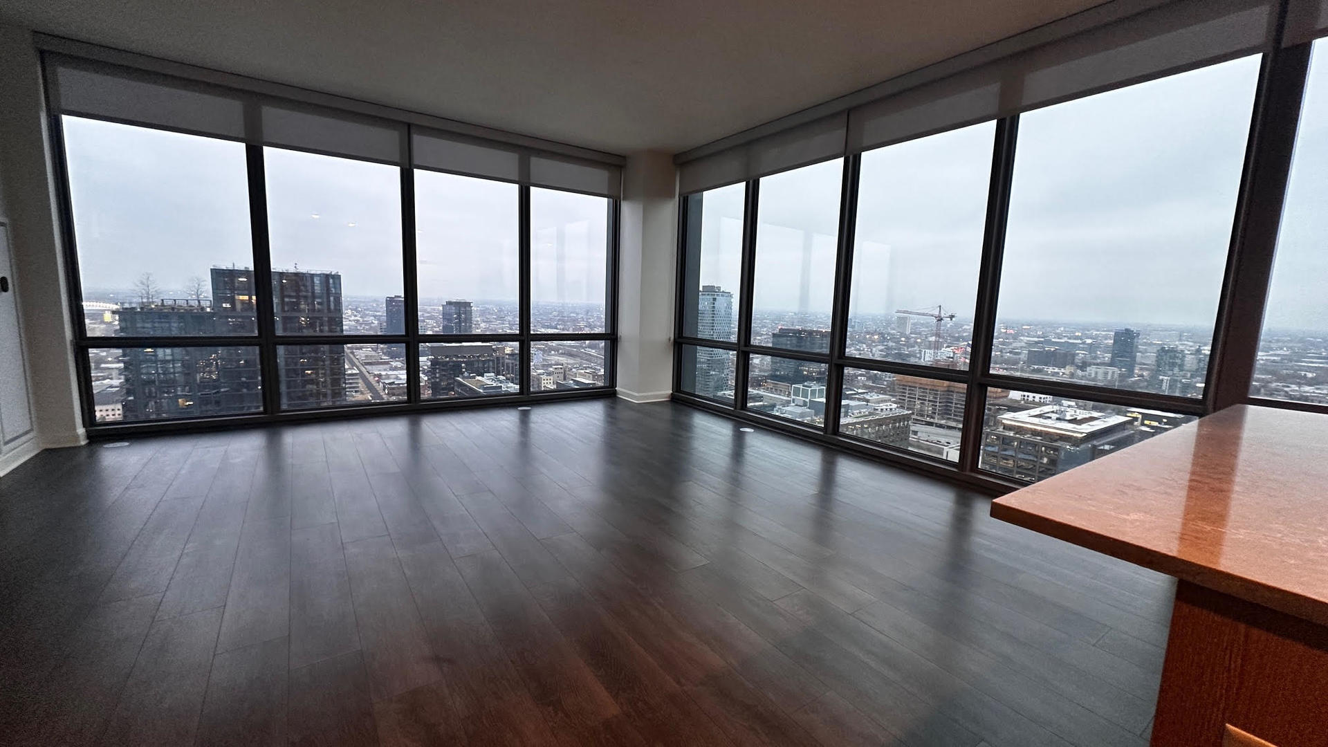 164 North Peoria Street, Unit 3002 Chicago, IL 60607 - Photo 15 of 20 a view of an empty room with wooden floor and a floor to ceiling window