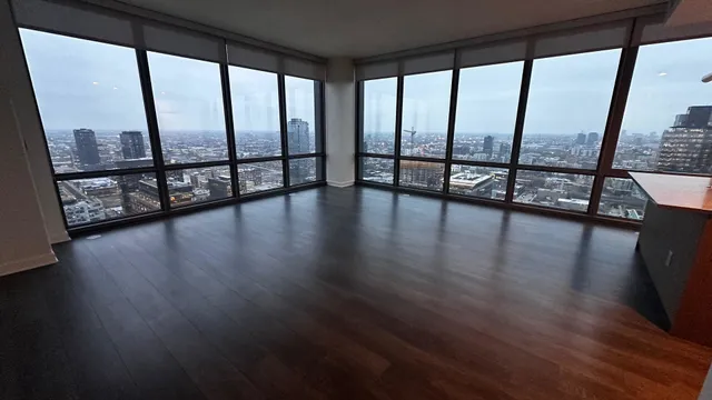 a view of an entryway with wooden floor