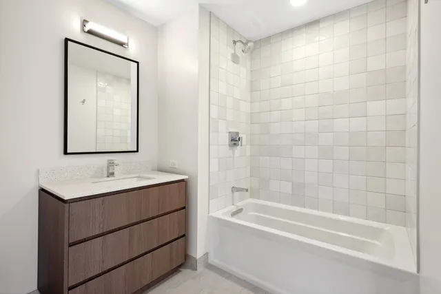 a bathroom with a bathtub and a sink