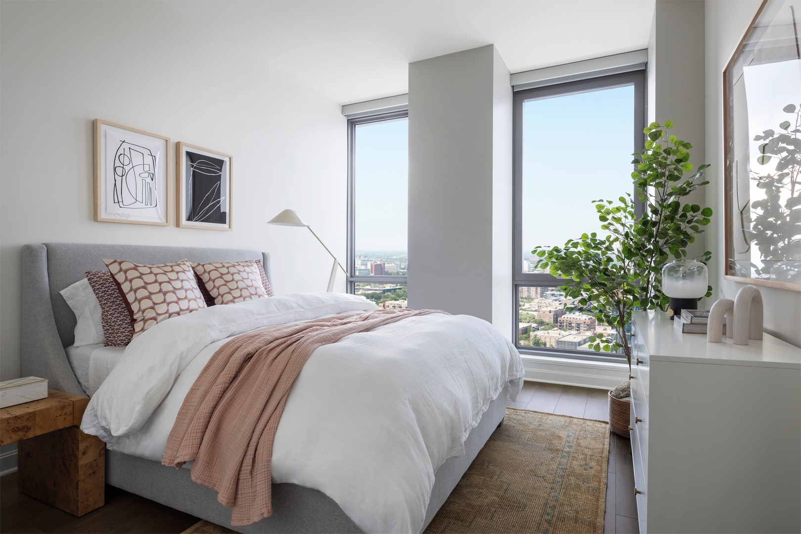 164 North Peoria Street, Unit 3002 Chicago, IL 60607 - Photo 7 of 20 a bedroom with a large bed and a potted plant