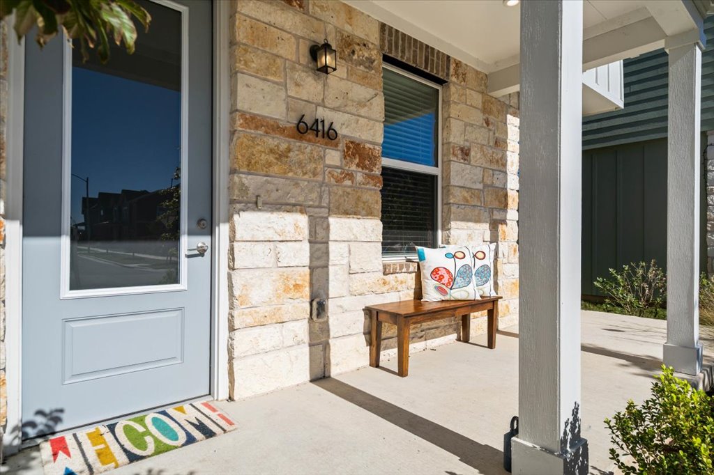 6416 Cowman Way Austin, TX 78747 - Photo 3 of 30 a balcony view with a glass door