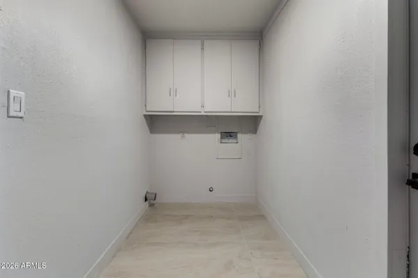 a view of cabinets and utility room