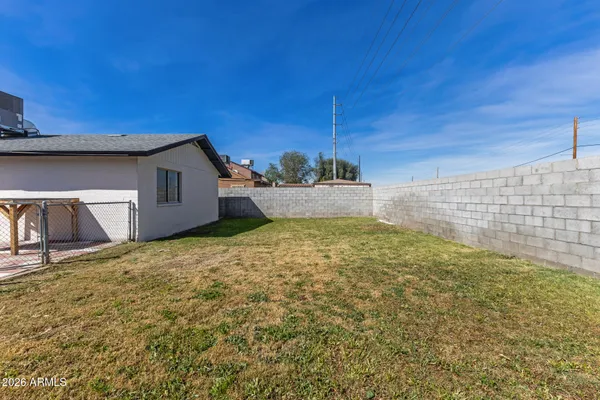 a view of a backyard of the house