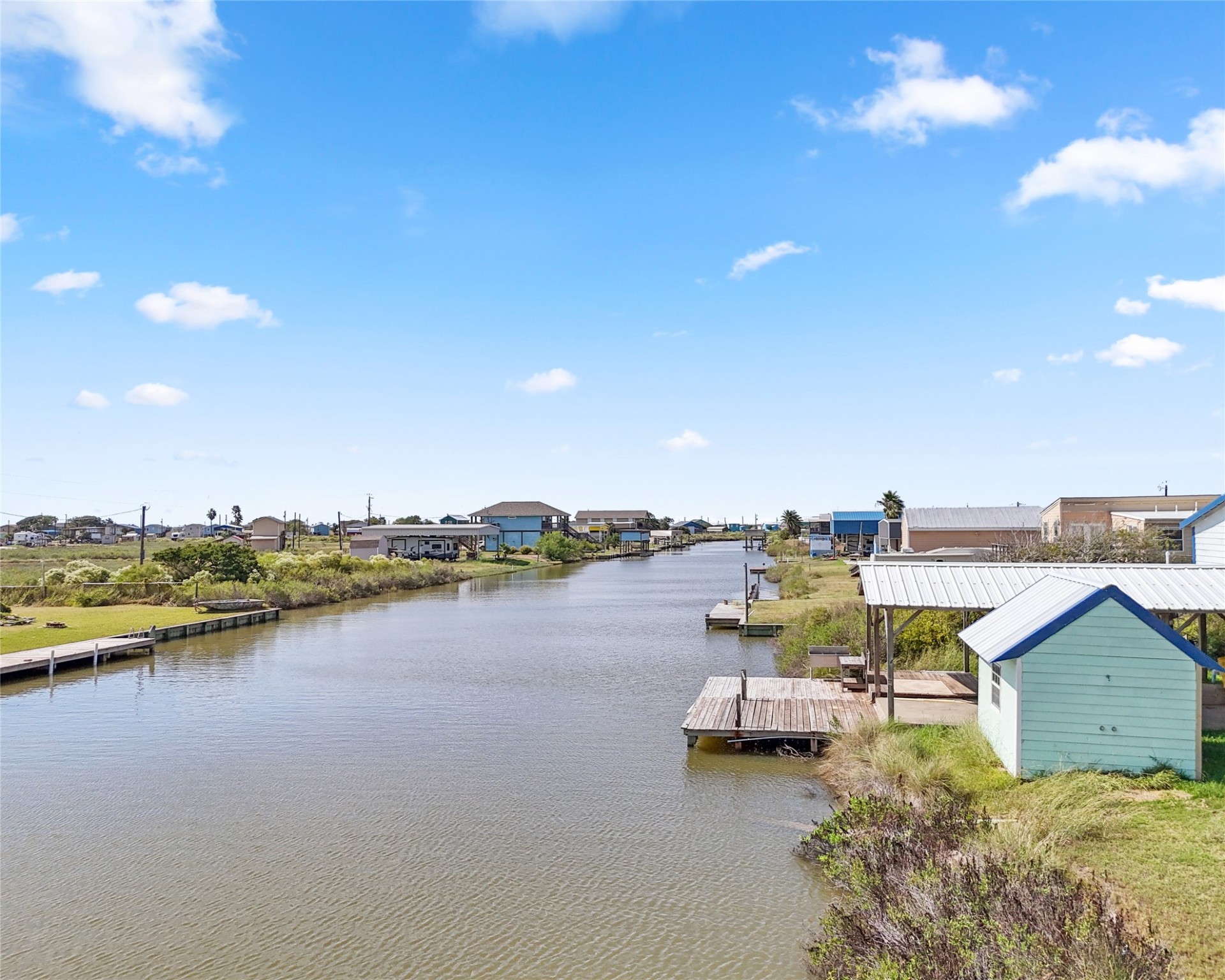14507 Chimaera Road Sargent, TX 77414 - Photo 14 of 27 a view of a lake with couches and city view